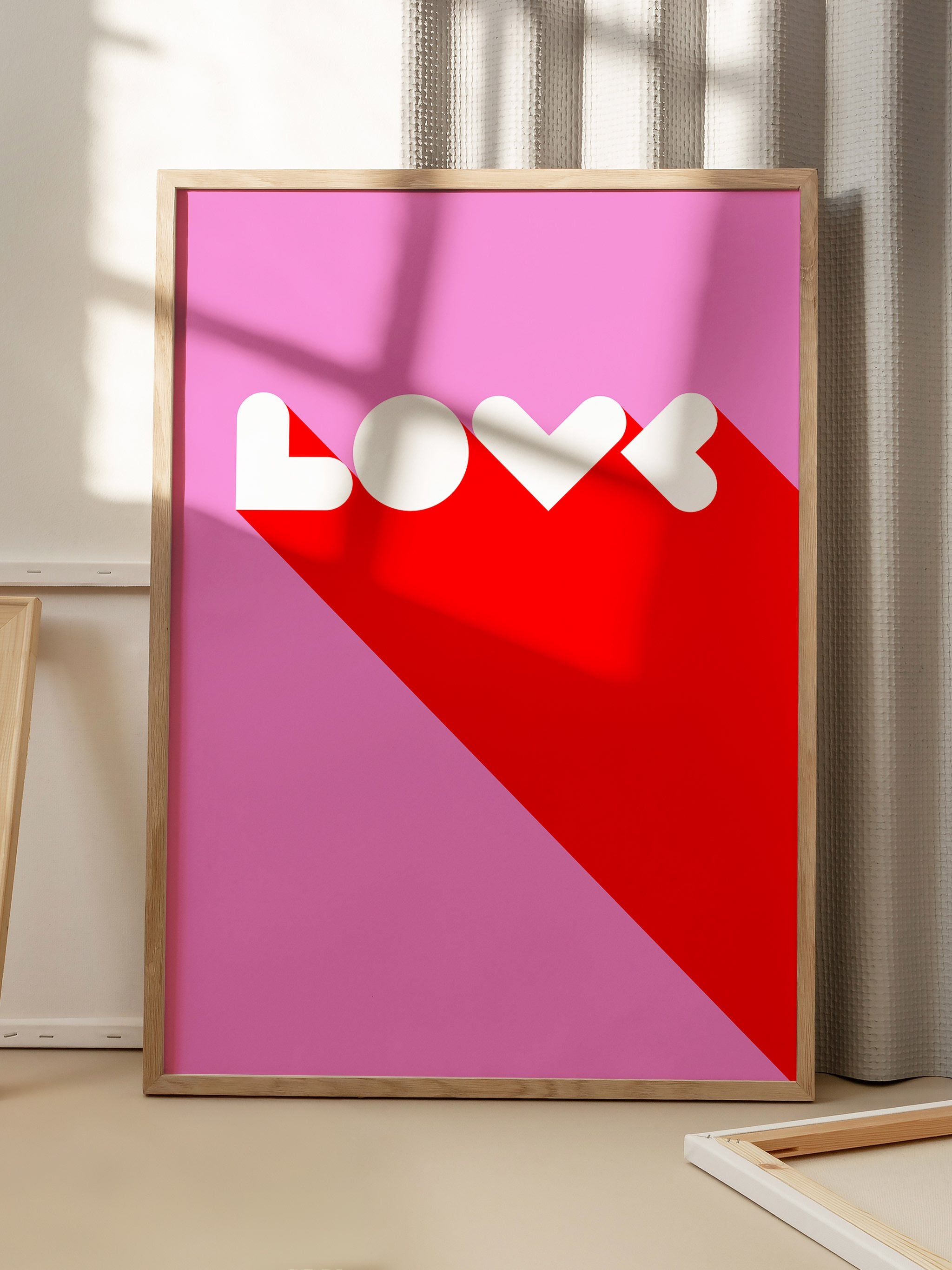 Printed poster with Love typography and vibrant colors